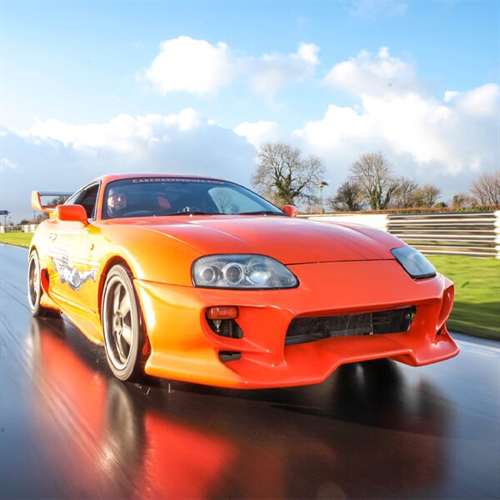 Toyota Supra Driving - Orange Race Car Toyota Supra Driving - Orange Race Car